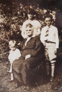 Lester (upper right) with his sister Frances, little brother Wallace, and their grandmother.
